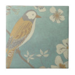 Yellow, Grey and Beige Bird Perched on a Branch Tile<br><div class="desc">Chariklia Zarris is known for her abstract art pieces. In this drawing of a profile of a bird on a blue teal background, she captured the simplicity of the bird. The white flowers add a romantic touch. Customize your favourite Zazzle product using this beautiful image.</div>