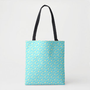 Yellow hearts on a blue background tote bag