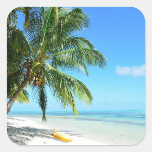 Yellow kayak on a white sand beach sticker