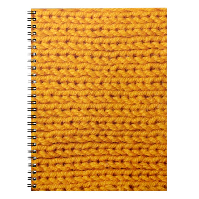 Yellow knitted wool texture background pattern wit notebook (Front)