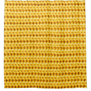 Yellow knitted woolen fabric background
