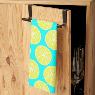Yellow Lemon slised on blue background Kitchen Towel