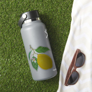 Yellow Lemon with Green Leaves and White Flower
