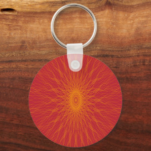 Yellow mandala rays on red keychain
