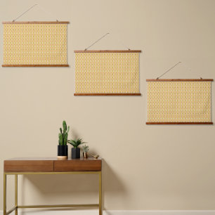 Yellow, orange, and brown sheets of wrapping paper hanging tapestry