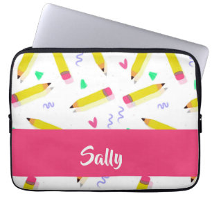 Yellow pencils and scrabbles on white laptop sleeve
