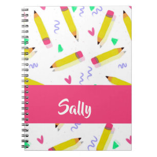 Yellow pencils and scrabbles on white notebook