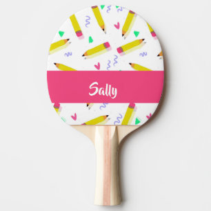 Yellow pencils and scrabbles on white ping pong paddle