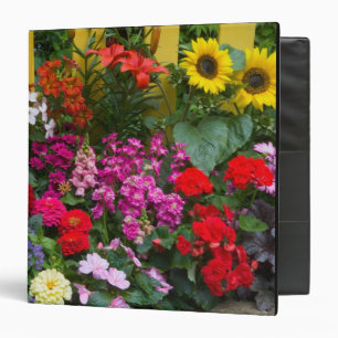 Yellow picket fence with flower garden in binder