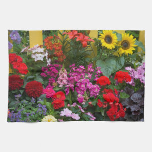Yellow picket fence with flower garden in kitchen towel