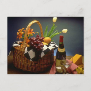 Yellow Picnic basket with wine, cheese, bread and Postcard
