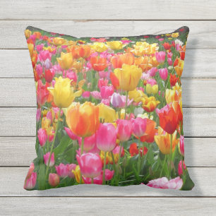 Yellow pink orange red tulips outdoor pillow