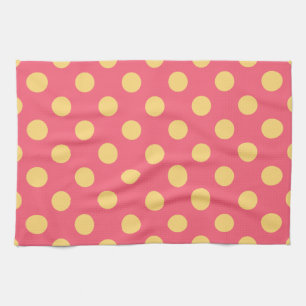 Yellow polka dots on coral kitchen towel