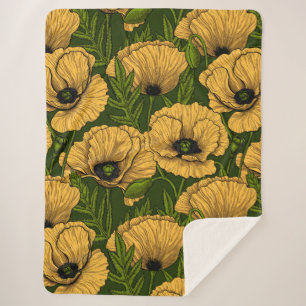 Yellow poppies on dark green sherpa blanket