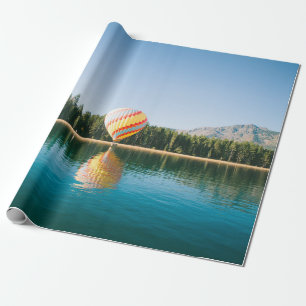 Yellow, red, and blue hot air balloon near trees a wrapping paper