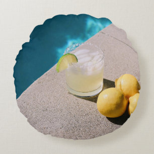 Yellow round fruits on grey table pillow