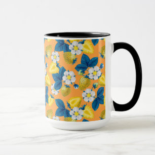 Yellow strawberries on orange mug