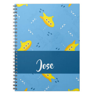 Yellow submarine and fish on blue notebook