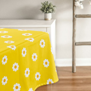 Yellow tablecloth with daisies