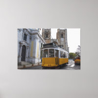 Yellow tram on Lisbon Cathedral in Portugal