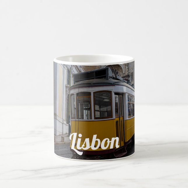 Yellow tram on Lisbon Cathedral in Portugal Coffee Mug (Center)