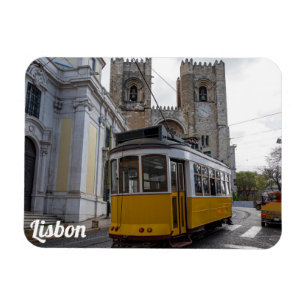 Yellow tram on Lisbon Cathedral in Portugal Magnet