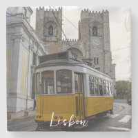 Yellow tram on Lisbon Cathedral in Portugal