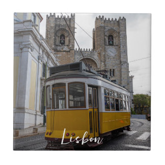 Yellow tram on Lisbon Cathedral in Portugal Tile