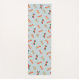 Yoga mat with cheerful dragonfly pattern.
