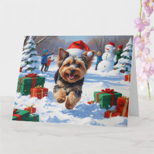 Yorkipoo Running in Snow with Christmas Hat Card