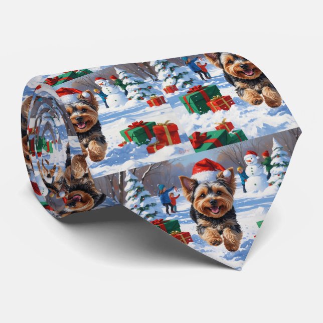 Yorkipoo Running in Snow with Christmas Hat Tie (Rolled)