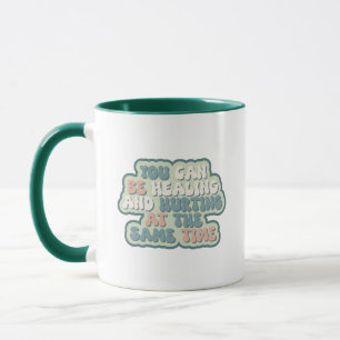 You can be healing and hurting at the same time mug