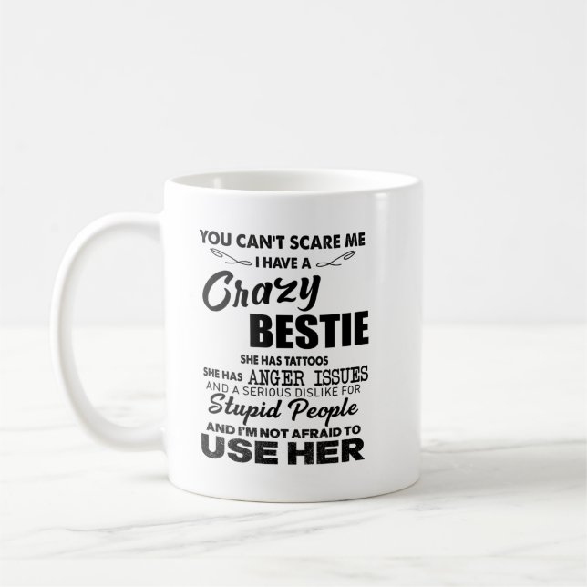 You can't scare me i have a crazy bestie she tatto coffee mug (Left)