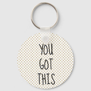You got this gold glitter dot keychain
