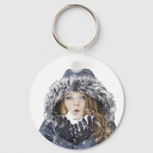 Young beautiful girl in winter keychain