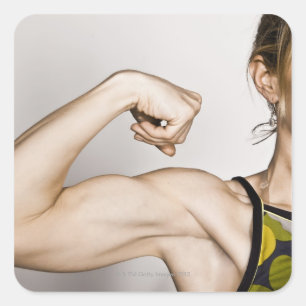 Young blonde female flexes bicep muscle while square sticker