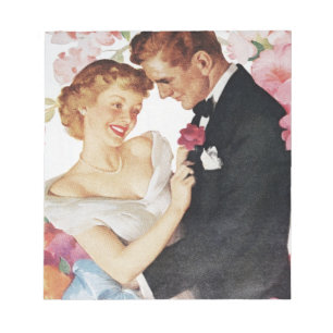 Young couple in formal wear notepad