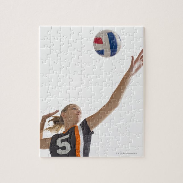 Young girl (16-17) playing volleyball jigsaw puzzle (Vertical)
