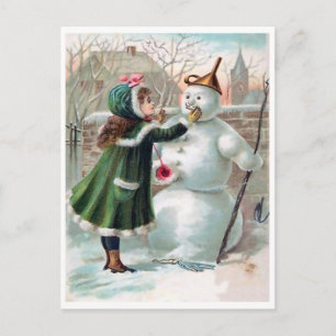 Young girl is making a snowman, vintage holiday postcard