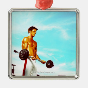 Young man exercising with barbells metal ornament