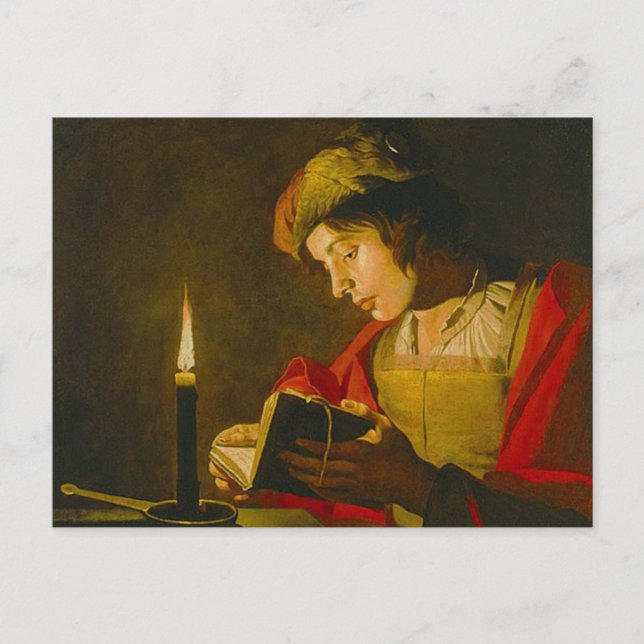 Young man reading by candlelight postcard (Front)