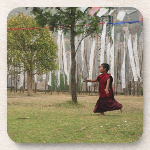 Young monk and prayer flags coaster
