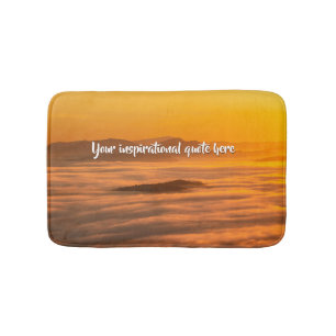Your custom text sunrise above foggy landscape bath mat