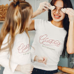 Your Family Christmas Modern Script Family Name T-Shirt<br><div class="desc">Modern,  minimalist Christmas calligraphy design with your family name for those matching family photos! Simple yet classic stylish in red and green,  this cute shirt makes for festive family flair! Rock the holidays in our personalized t-shirt with modern script. Unwrap the joy! 🎄👨‍👩‍👧‍👦 #ChristmasStyle #FamilyLove #FestiveFamily</div>