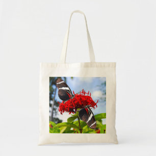 Zebra longwing butterflies on red flowers tote bag