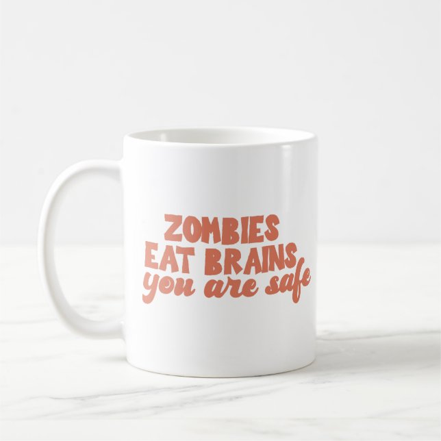 Zombies Eat Brains You Are Safe Coffee Mug (Left)